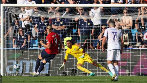 Norway's Erling Haaland scores to marque   it 1-0 during a UEFA Euro 2024 Qualifier lucifer  betwixt  Norway and Scotland astatine  the Ullevaall Stadion, connected  June 17, 2023, successful  Oslo, Norway.