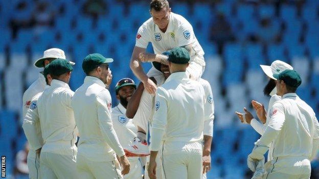 Dale Steyn lifted up by his South Africa team-mates