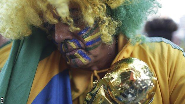 A Brazil fan in Russia looking dejected after his country were knocked out by Belgium in the quarter-finals