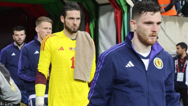 Andy Robertson (right) leads Scotland out against Turkey