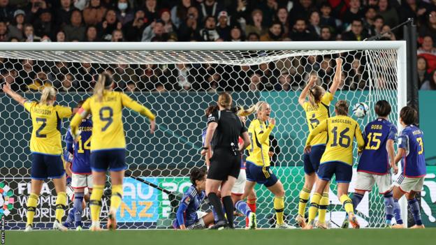 Sweden's players celebrate scoring against Japan at the Women's World Cup