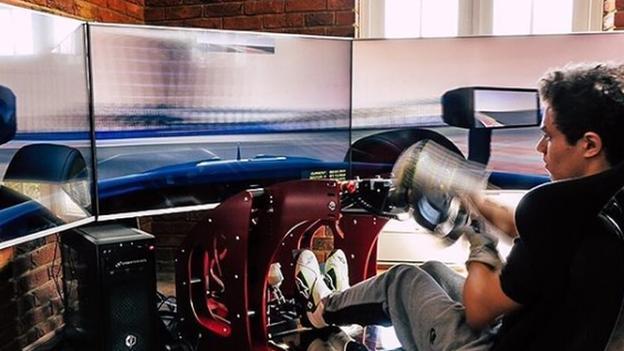 Lando Norris with his racing sim set up in his home