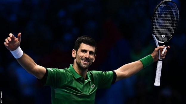 Novak Djokovic celebrates after winning his sixth ATP Finals title