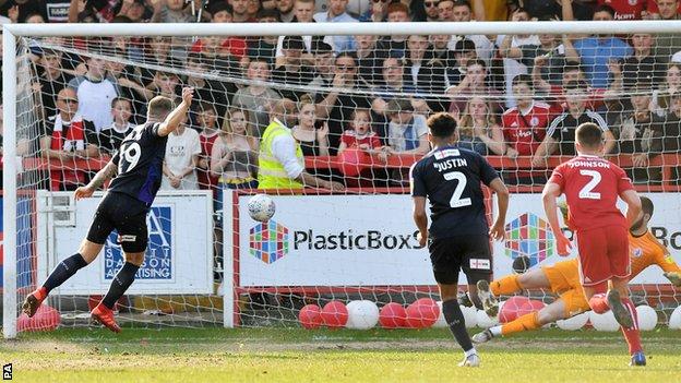 James Collins scores a penalty for Luton to put them 1-0 up at Accrington