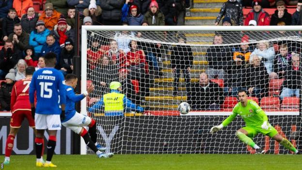 James Tavernier's late penalty rescued a point for Rangers at Aberdeen