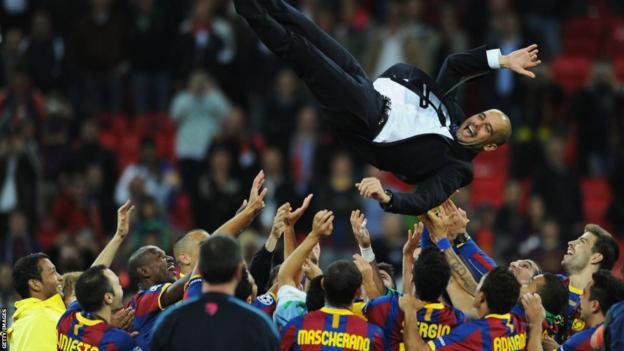Barcelona football manager Pep Guardiola is lifted into the air following his side's second Champions League win.