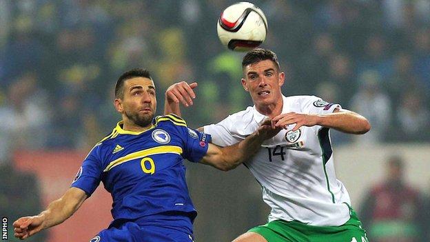 Republic of Ireland defender Ciaran Clarke is about to challenge Bosnia & Herzegovina's Vedad Ibisevic