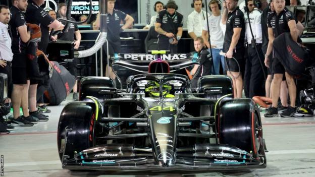 Lewis Hamilton leaves his pit garage in the Mercedes