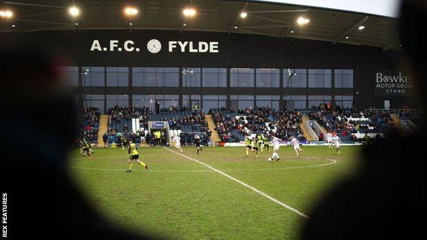 Fans watch a match at AFC Fylde