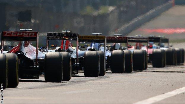 Formula 1 cars line up on the grid