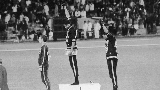 American track and field athletes Tommie Smith and John Carlos protest with the Black Power salute at the 1968 Olympics