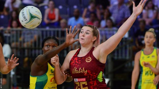 Australia's Sunday Aryang (left) and England's Eleanor Cardwell (right) compete for the ball