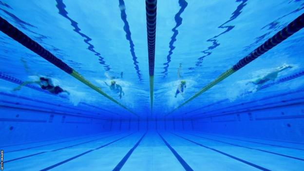 An underwater photo of swimmers doing the front crawl