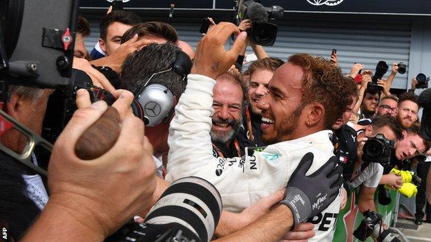 Lewis Hamilton celebrates winning the Italian GP