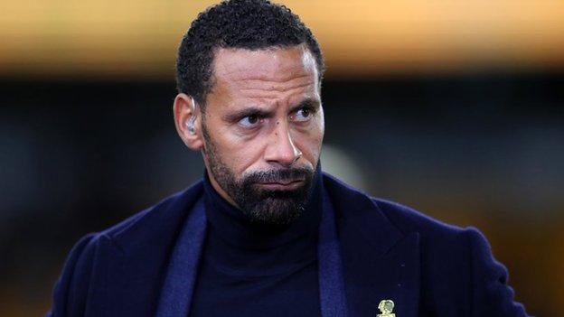 Rio Ferdinand with a television earpiece in