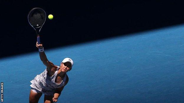 Ashleigh Barty serves at Australian Open