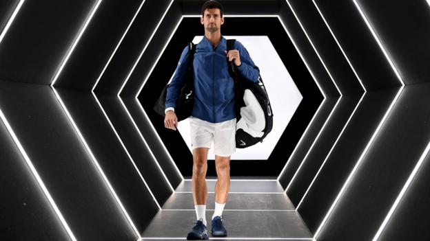 Novak Djokovic walks onto court ahead of the Paris Masters final against Karen Khachanov