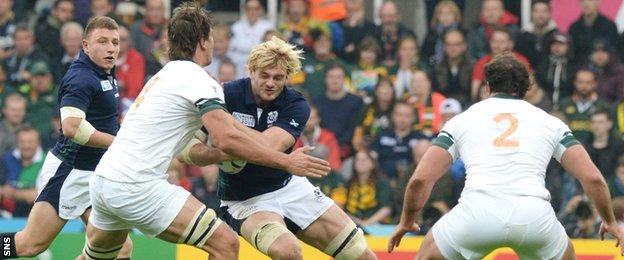 Richie Gray is tackled by South Africa's 6ft 8in lock Eben Etzebeth