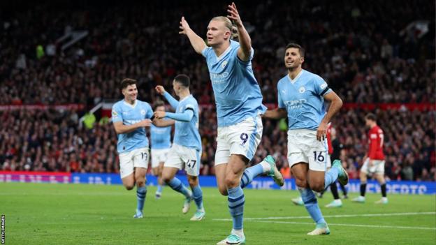 Erling Haaland celebrates scoring for Manchester City against Manchester United at Old Trafford