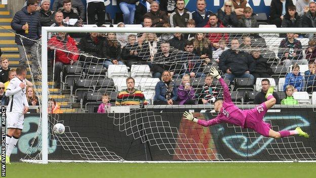 Swansea goalkeeper Freddie Woodman is beaten as Stoke's Sam Clucas equalises