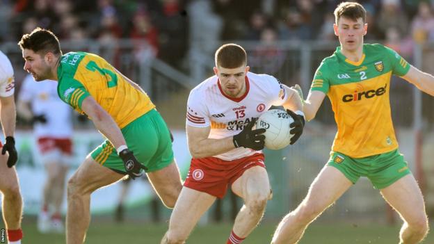 Tyrone's Cathal McShane in action against Brendan McCole and Mark Curran