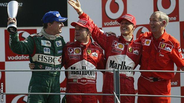 Eddie Irvine, Rubens Barrichello, Michael Schumacher and Rory Byrne in 2002