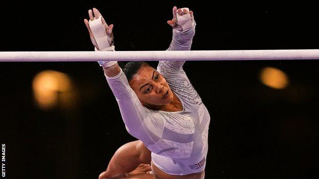 Becky Downie competing on the uneven bars