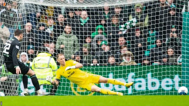 Josh Campbell scores a penalty for Hibernian against Celtic