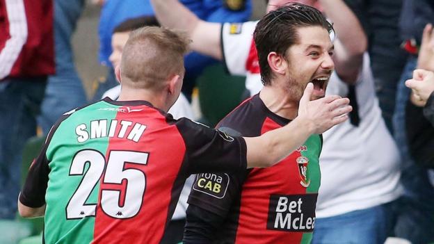 Glentoran's Curtis Allen celebrates after scoring an equaliser with the last kick of the game against Linfield
