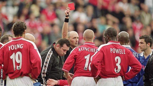 Mike Dean shows a red card in a game between Charlton and Leicester in 2001