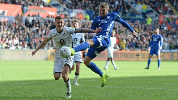 Cardiff City's Danny Ward tussles with Swansea's Ben Wilmot