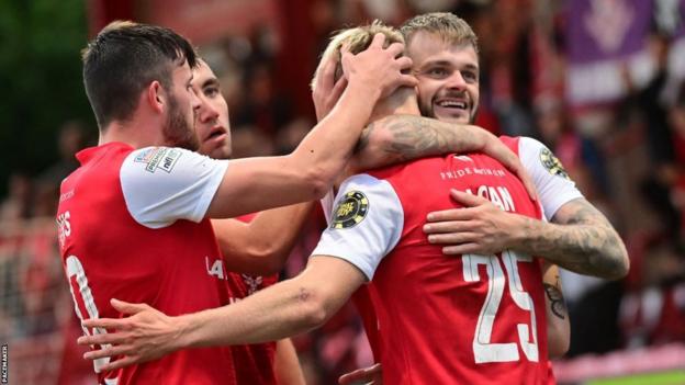 Larne celebrate one of their four goals