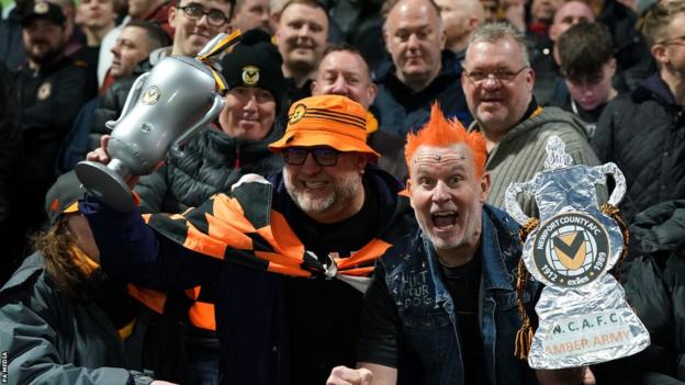 Newport County fans smile at Rodney Parade.