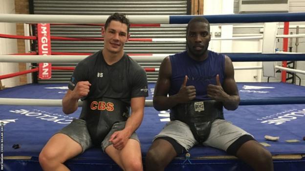 Lawrence Okolie and Chris Billam-Smith in the McGuigan gym together sitting side by side