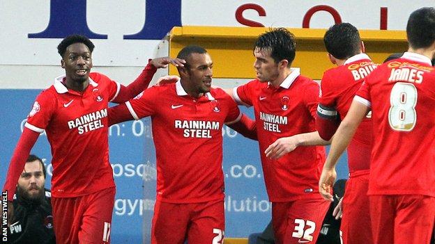 Leyton Orient's players celebrate their goal against Mansfield Town