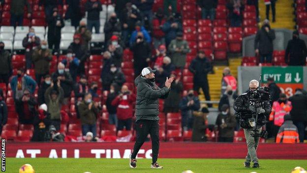 Jurgen Klopp applauds the fans at Anfield