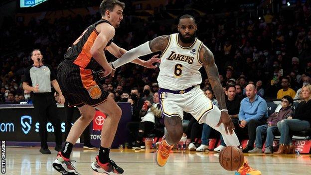 LeBron James of the Los Angeles Lakers against Franz Wagner of the Orlando Magic