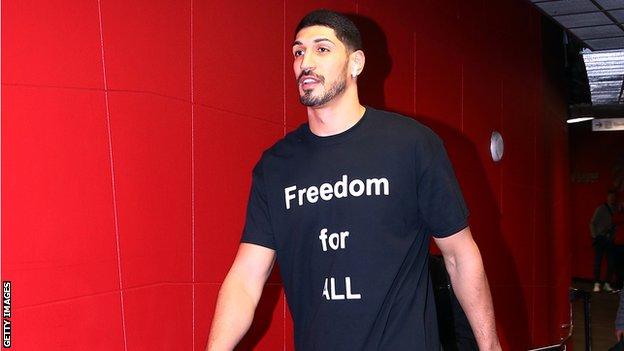 Enes Kanter in a t-shirt which reads 'freedom for all'