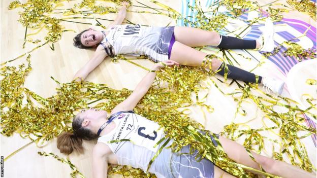 Beth Cobden and Natalie Panagarry of Loughborough Lightning celebrate the Netball Super League title win of 2023