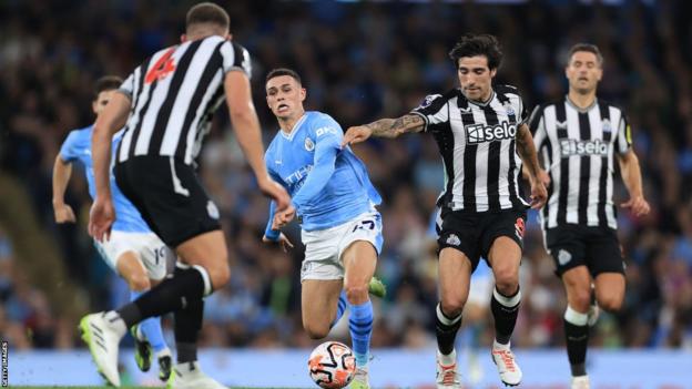 Phil Foden runs with the ball against Newcastle