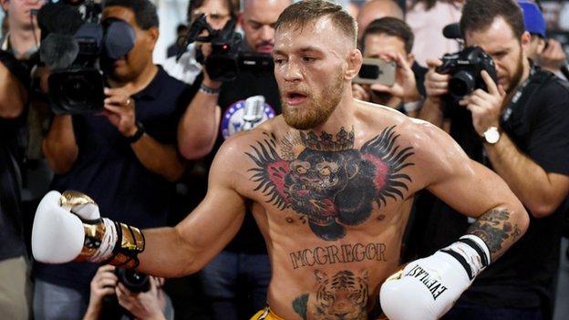 Conor McGregor trains in front of the media
