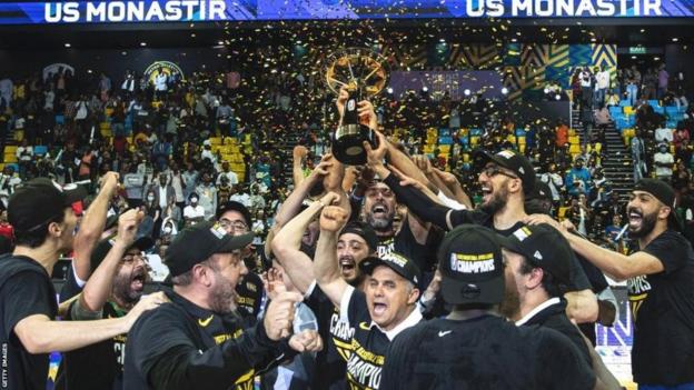 US Monastir celebrating with trophy after winning 2022 BAL