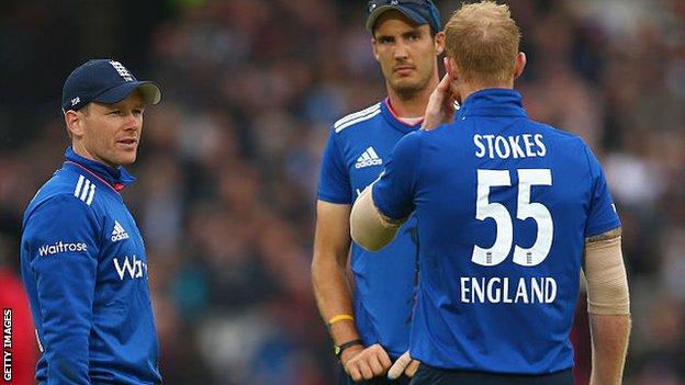 England's Eoin Morgan, Steven Finn and Ben Stokes
