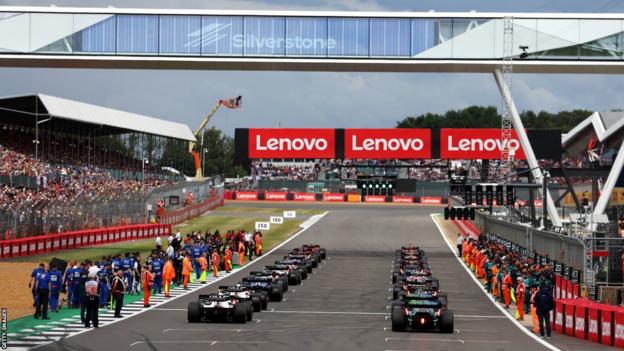 Drivers line up at Silverstone before the start of the 2022 British Grand Prix