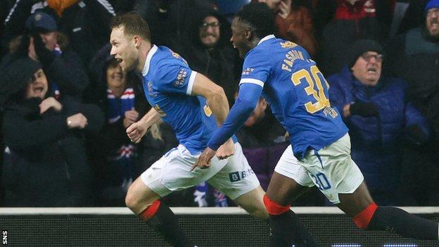 Substitute Scott Arfield broke the deadlock for Rangers late on