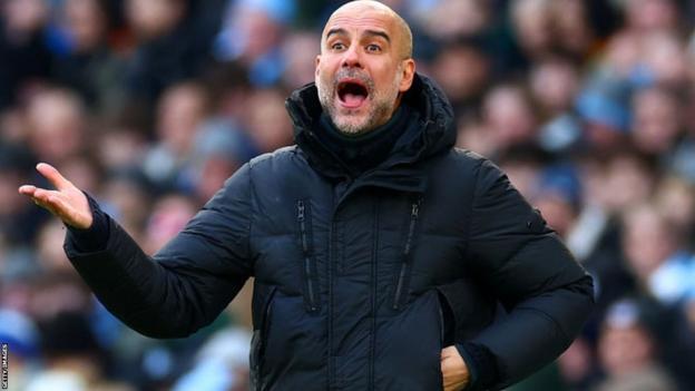 Manchester City boss Pep Guardiola looks on during a game