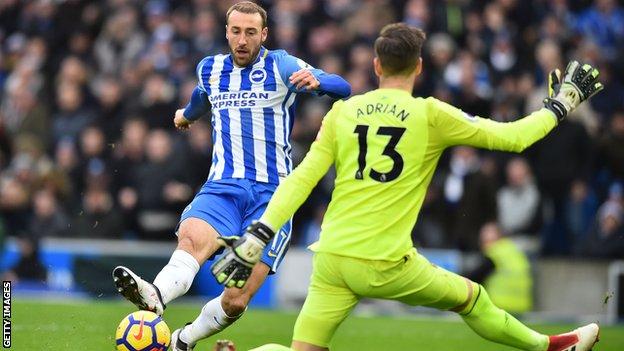 Glenn Murray steers the opening goal of the game past Adrian