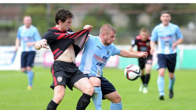 Coleraine captain Howard Beverland tangles with Ballymena winger David Cushley as the Bannsiders complete a 2-0 win