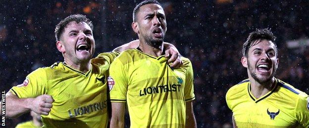 Oxford United celebrate victory at Notts County