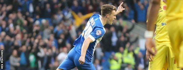 Solly March celebrates his early opener for Brighton